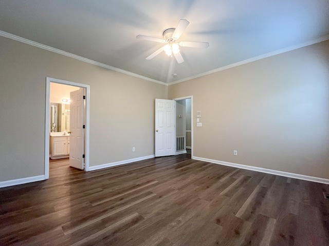 unfurnished bedroom with baseboards, dark wood finished floors, ornamental molding, and visible vents