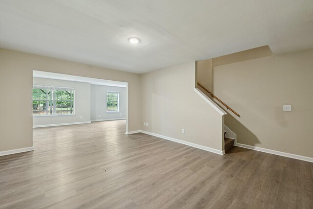2300 Devonshire Dr, Old Hickory, TN 37138 - unfurnished living room with light wood-style flooring, stairway, and baseboards