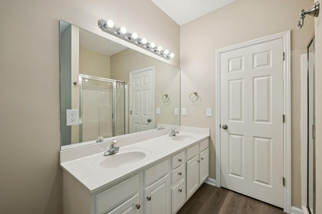 2300 Devonshire Dr, Old Hickory, TN 37138 - full bathroom with double vanity, a shower stall, and wood finished floors