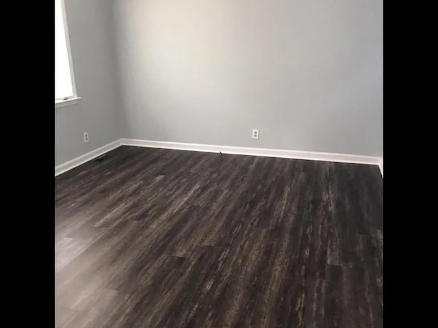 4660 Dover Rd, Indian Mound, TN 37079 - unfurnished room with baseboards and dark wood-style floors