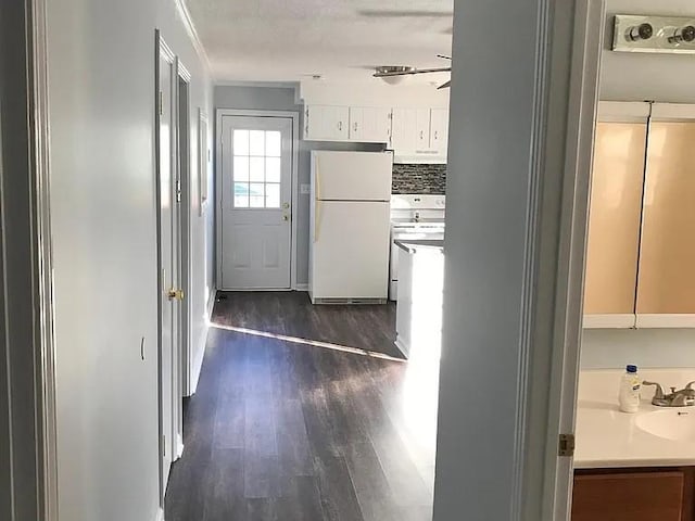4660 Dover Rd, Indian Mound, TN 37079 - hall with dark wood finished floors, ornamental molding, and a sink