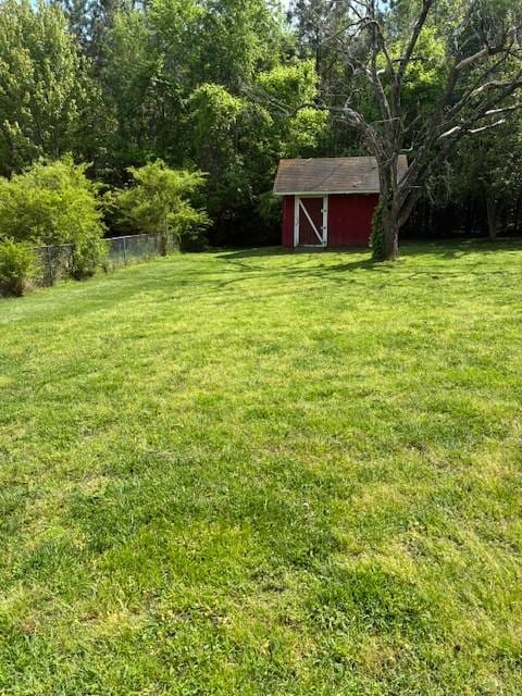 4660 Dover Rd, Indian Mound, TN 37079 - view of yard with an outdoor structure, fence, and a storage shed