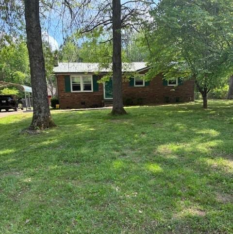 4660 Dover Rd, Indian Mound, TN 37079 - single story home with a carport, brick siding, and a front yard