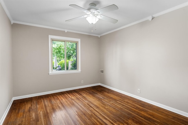 unfurnished room with a ceiling fan, baseboards, wood finished floors, visible vents, and ornamental molding