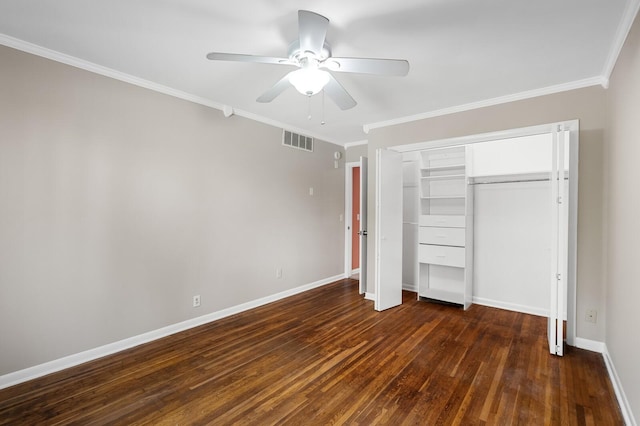 unfurnished bedroom featuring visible vents, ornamental molding, baseboards, and dark wood-type flooring