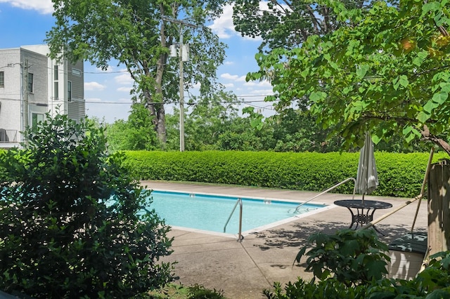 community pool with a patio