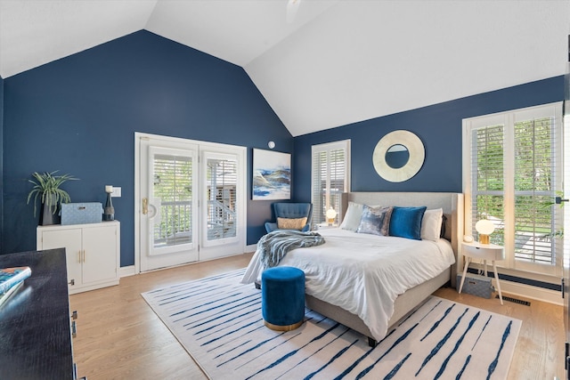 5960 Lickton Pike, Goodlettsville, TN 37072 - bedroom featuring access to outside, high vaulted ceiling, visible vents, and wood finished floors