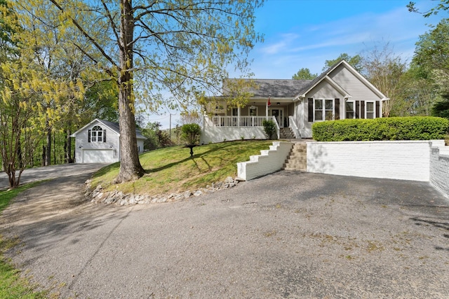 5960 Lickton Pike, Goodlettsville, TN 37072 - single story home featuring a front lawn, an outbuilding, a porch, driveway, and stairway