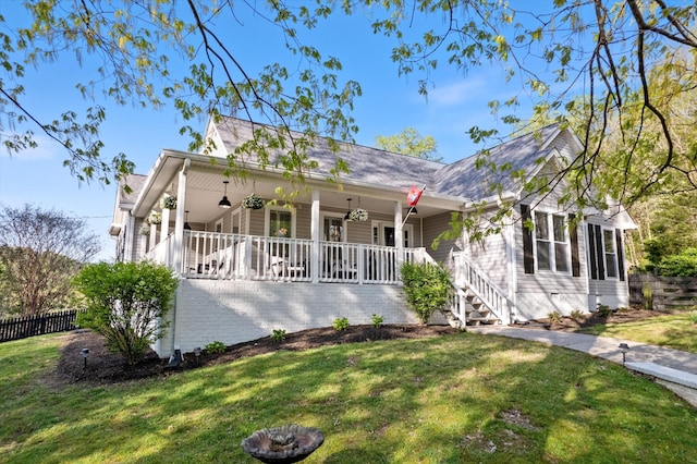 5960 Lickton Pike, Goodlettsville, TN 37072 - view of front facade with a porch, roof with shingles, a front yard, fence, and stairs