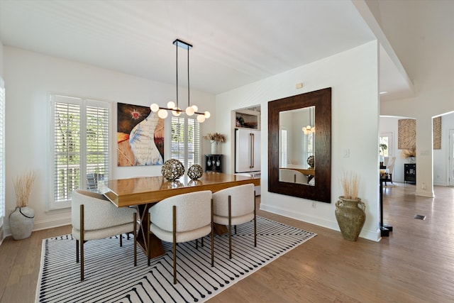 5960 Lickton Pike, Goodlettsville, TN 37072 - dining room featuring baseboards, wood finished floors, and a notable chandelier