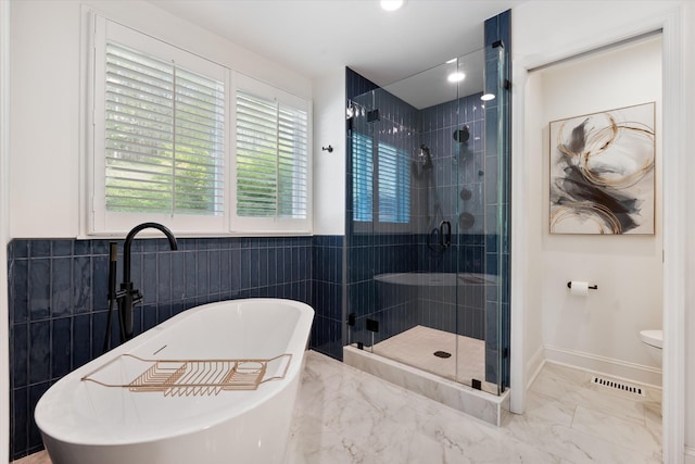 5960 Lickton Pike, Goodlettsville, TN 37072 - full bath featuring visible vents, marble finish floor, toilet, a soaking tub, and a shower stall