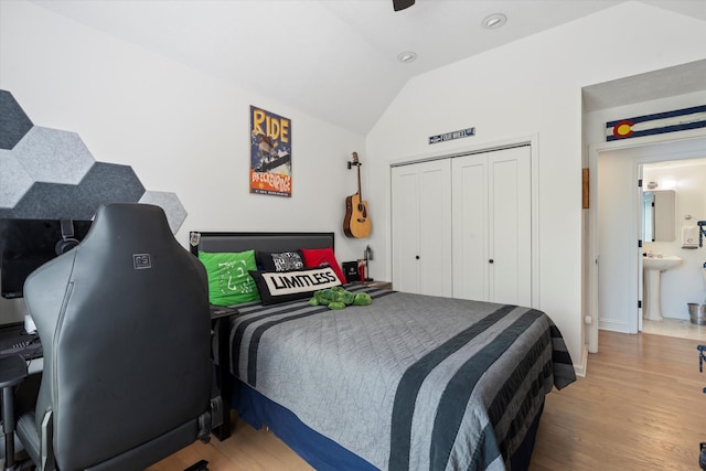 5960 Lickton Pike, Goodlettsville, TN 37072 - bedroom with a closet, a sink, wood finished floors, and vaulted ceiling