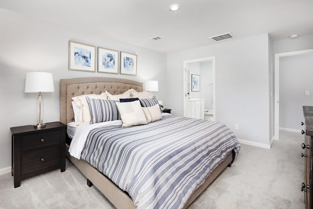 bedroom featuring baseboards, ensuite bathroom, light carpet, and visible vents