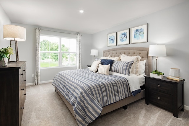 bedroom featuring recessed lighting, baseboards, and light colored carpet