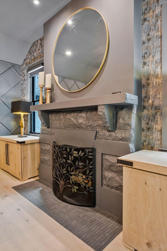 room details with a fireplace and wood finished floors