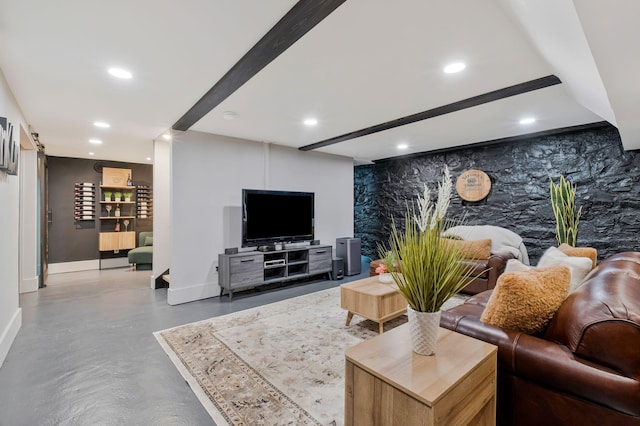 living room with finished concrete floors, recessed lighting, and baseboards