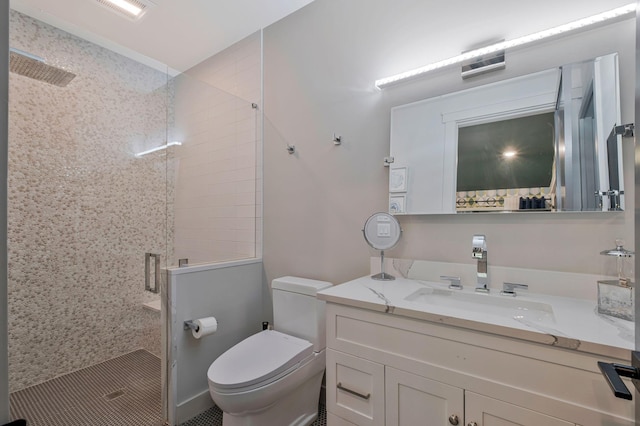 bathroom featuring toilet, visible vents, a shower stall, and vanity