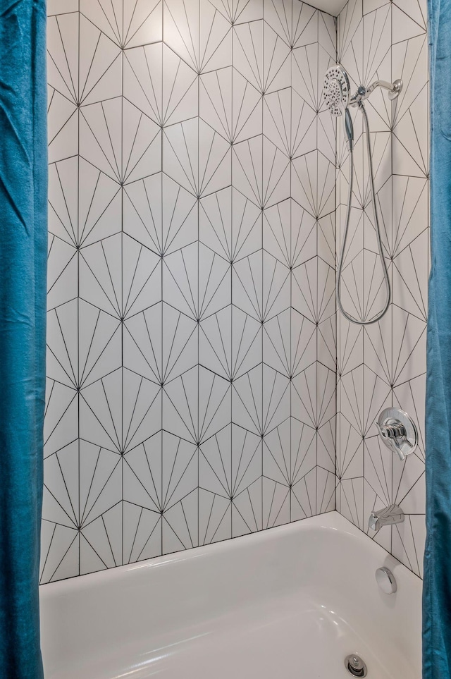 bathroom with shower / tub combo with curtain