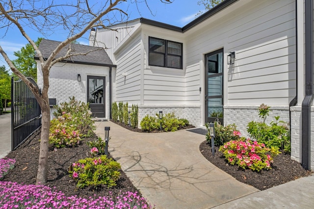 entrance to property with brick siding