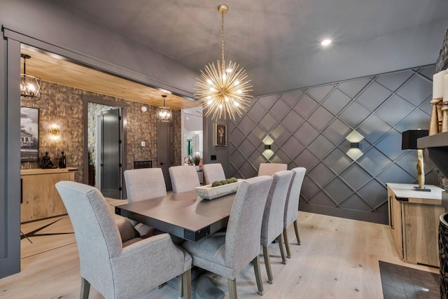 dining room featuring an inviting chandelier and light wood-type flooring