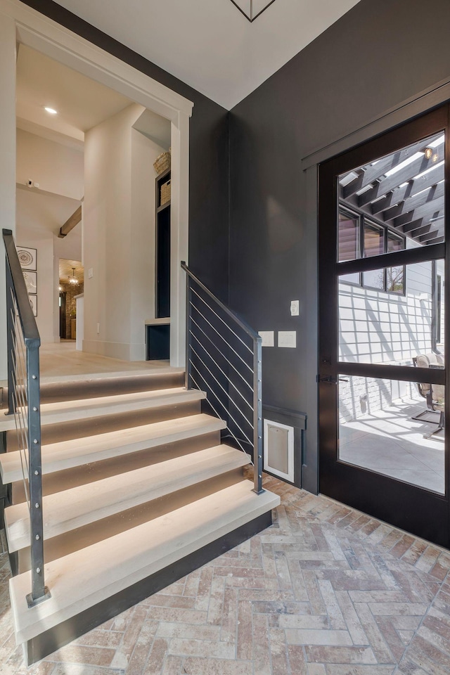 entrance foyer with brick floor and stairway