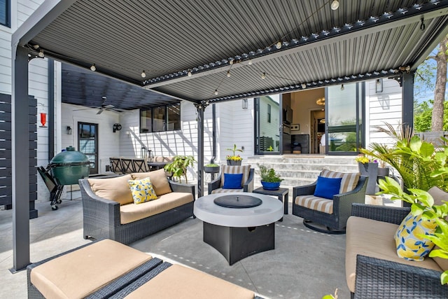 view of patio / terrace featuring an outdoor living space with a fire pit and ceiling fan