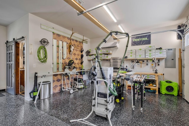 garage featuring a workshop area and electric panel