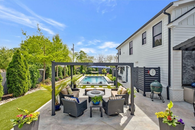 view of patio featuring a fenced in pool, a fenced backyard, and an outdoor living space with a fire pit