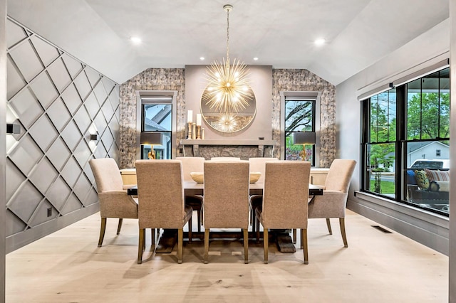 1409 Adams St, Franklin, TN 37064 - dining area with vaulted ceiling, a chandelier, and an accent wall