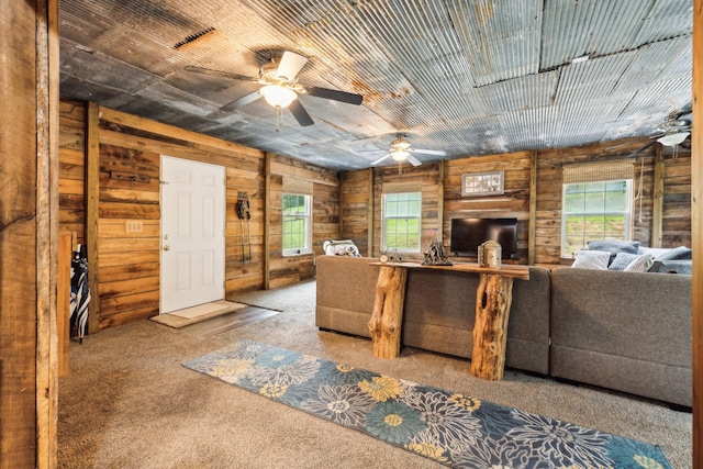 12817 Lascassas Pike, Milton, TN 37118 - living room featuring wooden walls, a ceiling fan, and carpet flooring