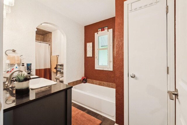 12817 Lascassas Pike, Milton, TN 37118 - full bathroom with a textured wall, wood finished floors, a garden tub, and vanity