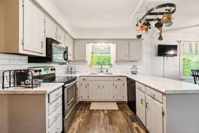 12817 Lascassas Pike, Milton, TN 37118 - kitchen with dark wood-style flooring, electric range, a peninsula, a sink, and dishwasher