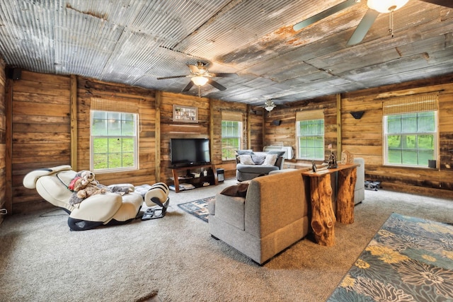 12817 Lascassas Pike, Milton, TN 37118 - living room with carpet flooring, a ceiling fan, a healthy amount of sunlight, and wooden walls