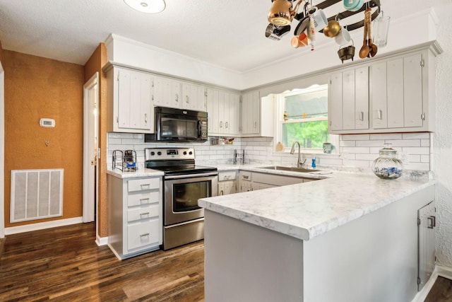 12817 Lascassas Pike, Milton, TN 37118 - kitchen with visible vents, black microwave, a sink, a peninsula, and stainless steel electric stove