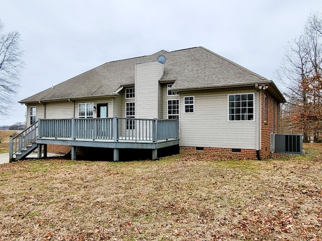back of property with crawl space, a chimney, roof with shingles, a deck, and central air condition unit