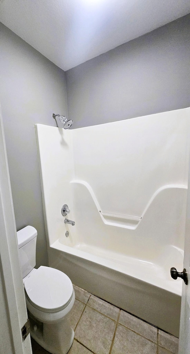 full bath with toilet and tile patterned floors