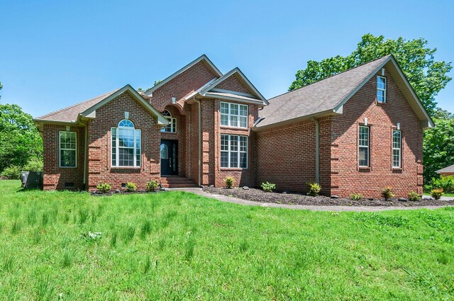 1031 Laurel Hill Dr, Dickson, TN 37055 - view of front facade with brick siding, crawl space, and a front lawn
