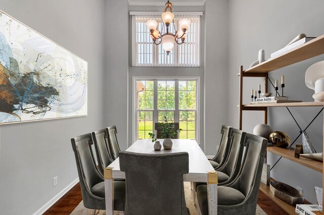 1031 Laurel Hill Dr, Dickson, TN 37055 - dining room featuring a chandelier, dark wood-style flooring, baseboards, and a high ceiling