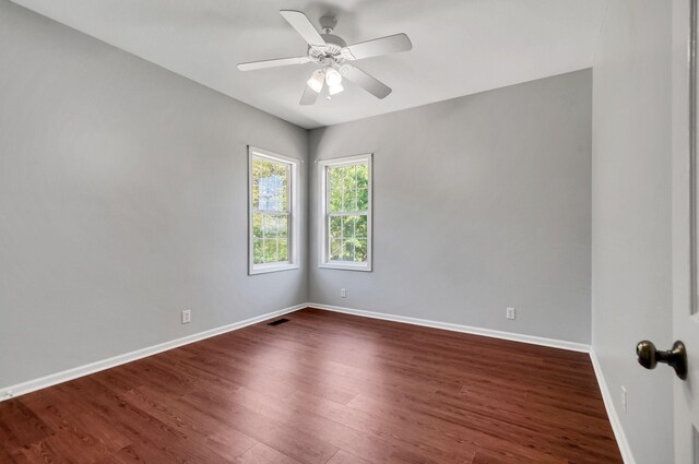 1031 Laurel Hill Dr, Dickson, TN 37055 - empty room with dark wood-style flooring, baseboards, and a ceiling fan