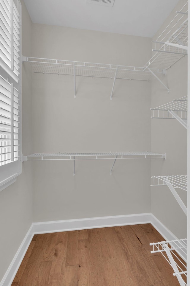 1020 Rural Plains Cir, Franklin, TN 37064 - spacious closet with wood finished floors and visible vents