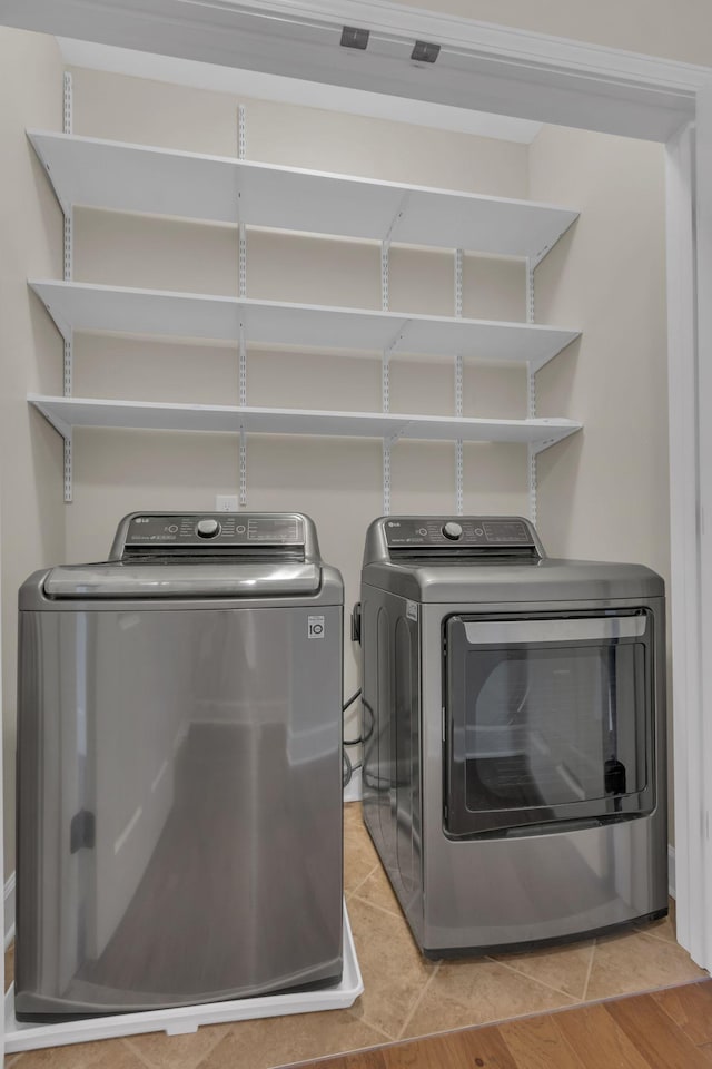 1020 Rural Plains Cir, Franklin, TN 37064 - laundry room featuring separate washer and dryer, laundry area, and light tile patterned floors