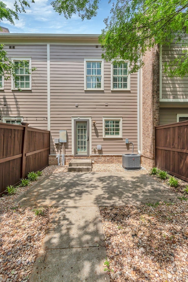 1020 Rural Plains Cir, Franklin, TN 37064 - rear view of property with central air condition unit, a patio, and a fenced backyard