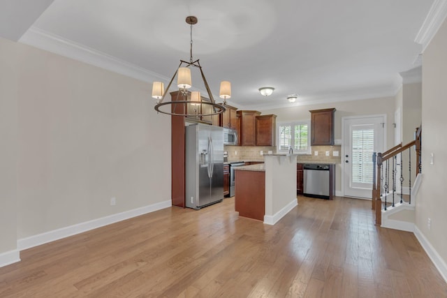 1020 Rural Plains Cir, Franklin, TN 37064 - kitchen with a notable chandelier, light countertops, stainless steel appliances, decorative backsplash, and ornamental molding