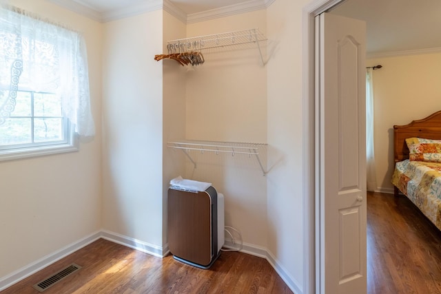 interior space with dark wood-style flooring and visible vents