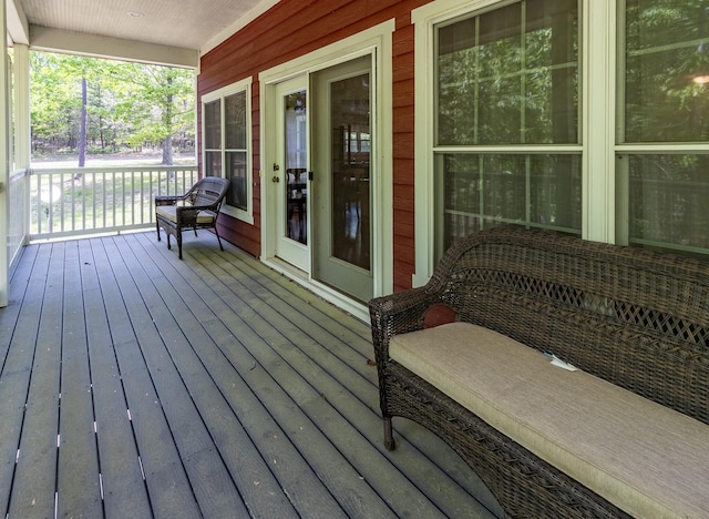 wooden terrace featuring covered porch