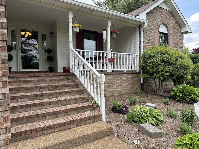 property entrance featuring covered porch