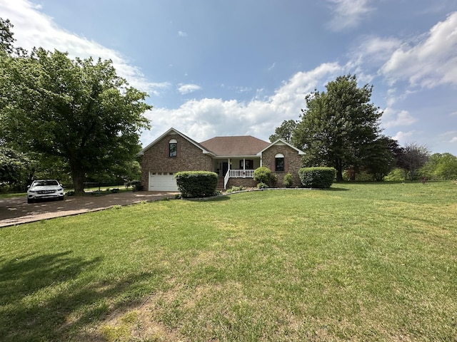 view of front of house featuring brick siding, a front lawn, an attached garage, and driveway