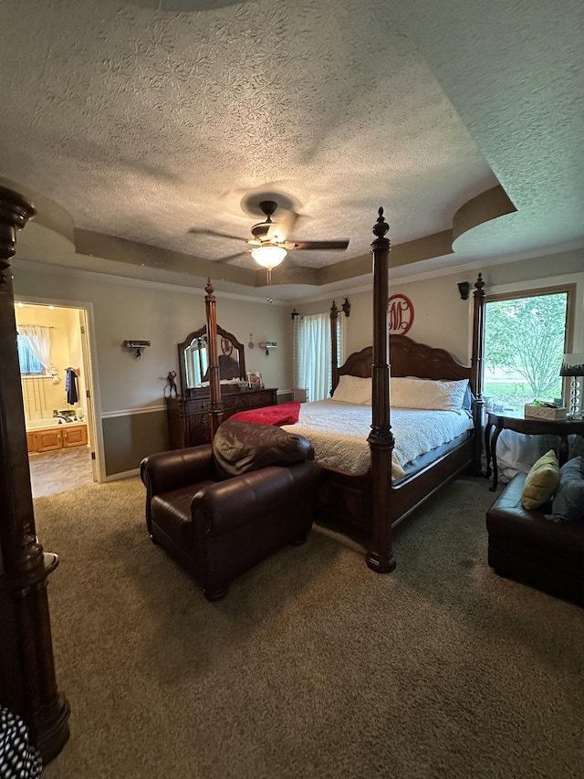 bedroom with connected bathroom, carpet flooring, a textured ceiling, and a ceiling fan