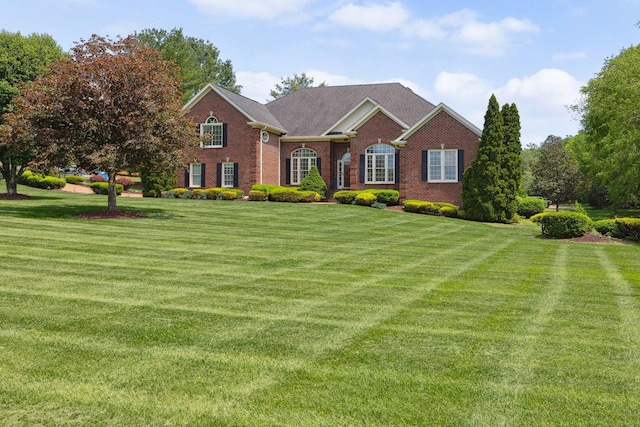4118 Oxford Glen Dr, Franklin, TN 37067 - view of front facade featuring brick siding and a front lawn