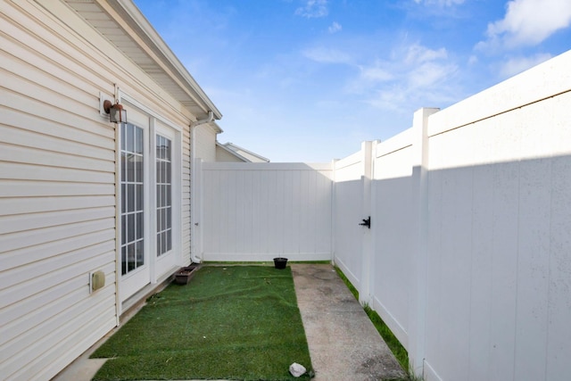 view of yard featuring fence and a gate